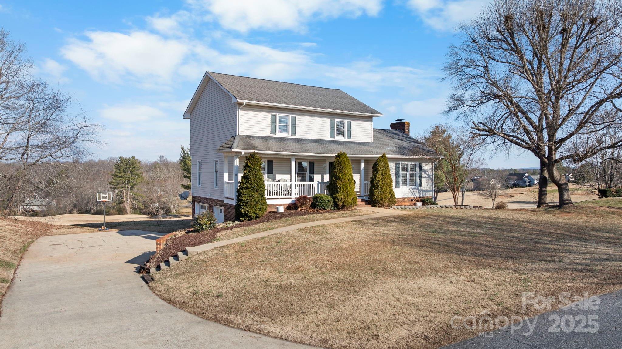 20 Meandering Way Granite Falls, NC 28630 - Photo 2 of 39 a front view of a house with yard and trees around