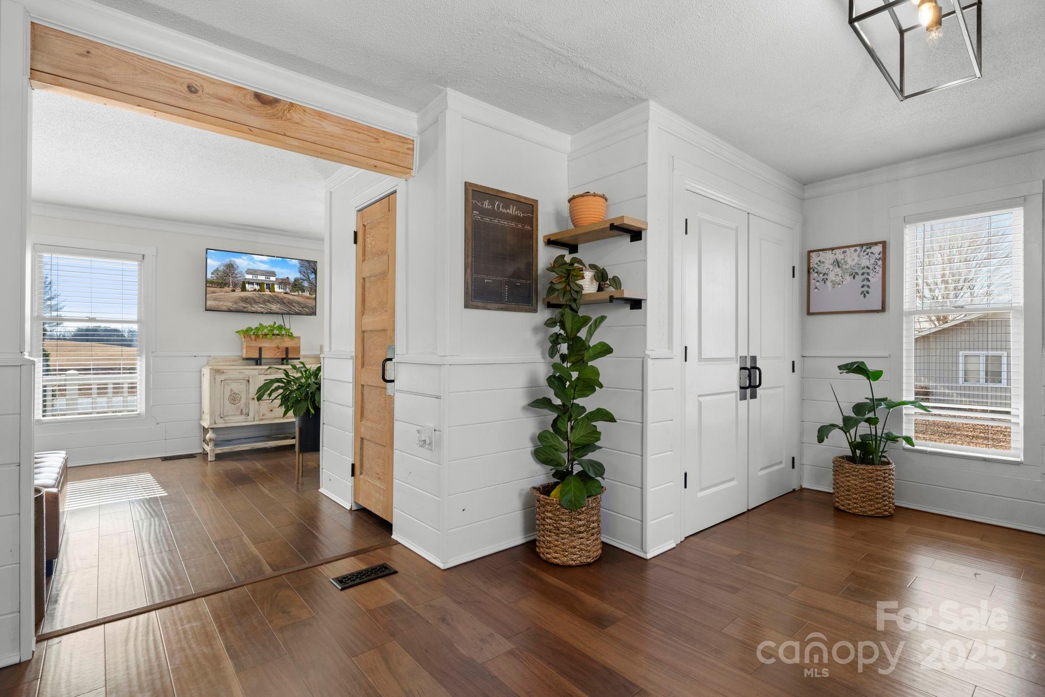 20 Meandering Way Granite Falls, NC 28630 - Photo 24 of 39 a view of an entryway with wooden floor and a potted plant