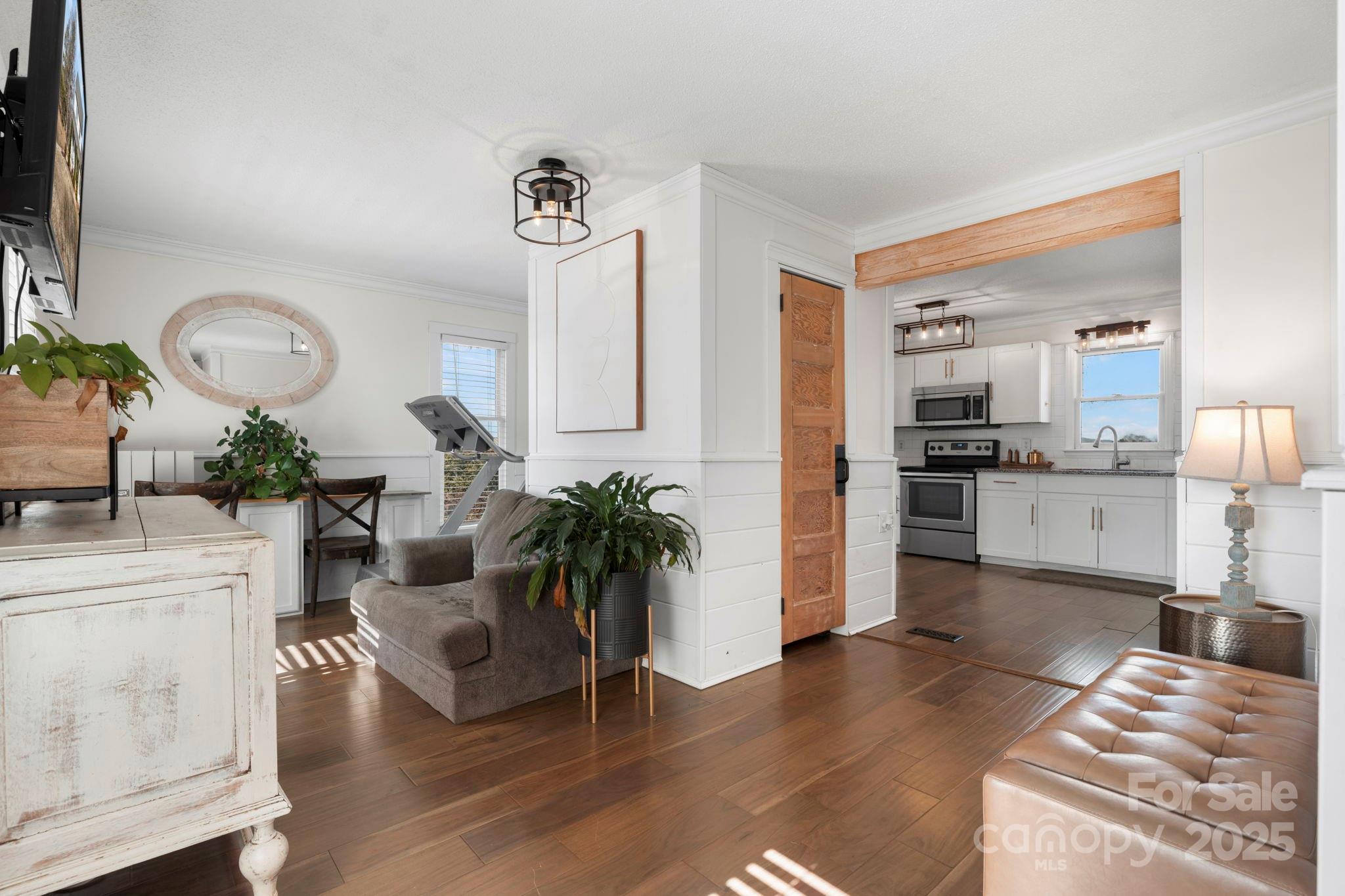 20 Meandering Way Granite Falls, NC 28630 - Photo 26 of 39 a living room with furniture potted plant kitchen view and a mirror