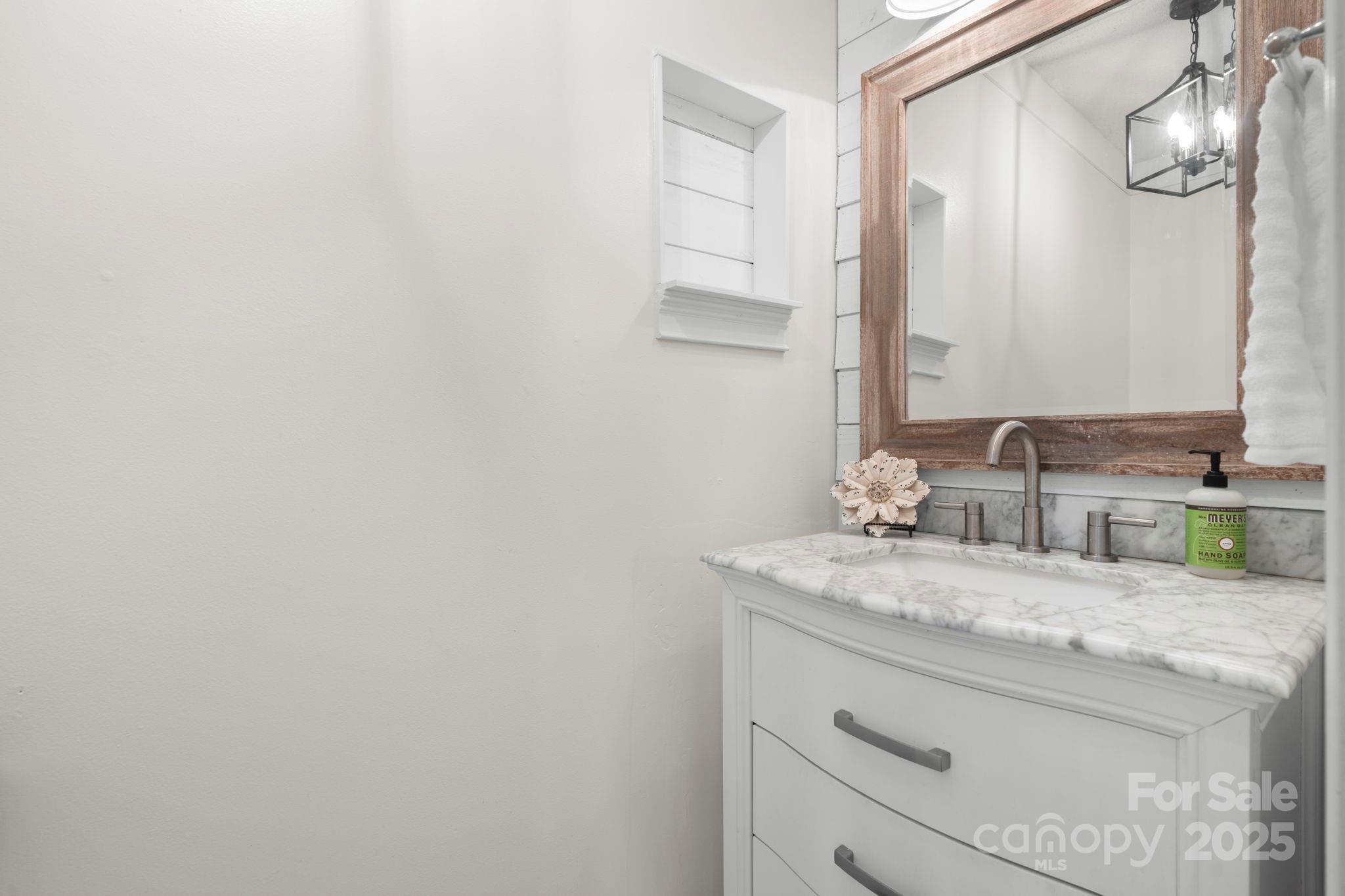 20 Meandering Way Granite Falls, NC 28630 - Photo 28 of 39 a bathroom with a granite countertop sink and a mirror