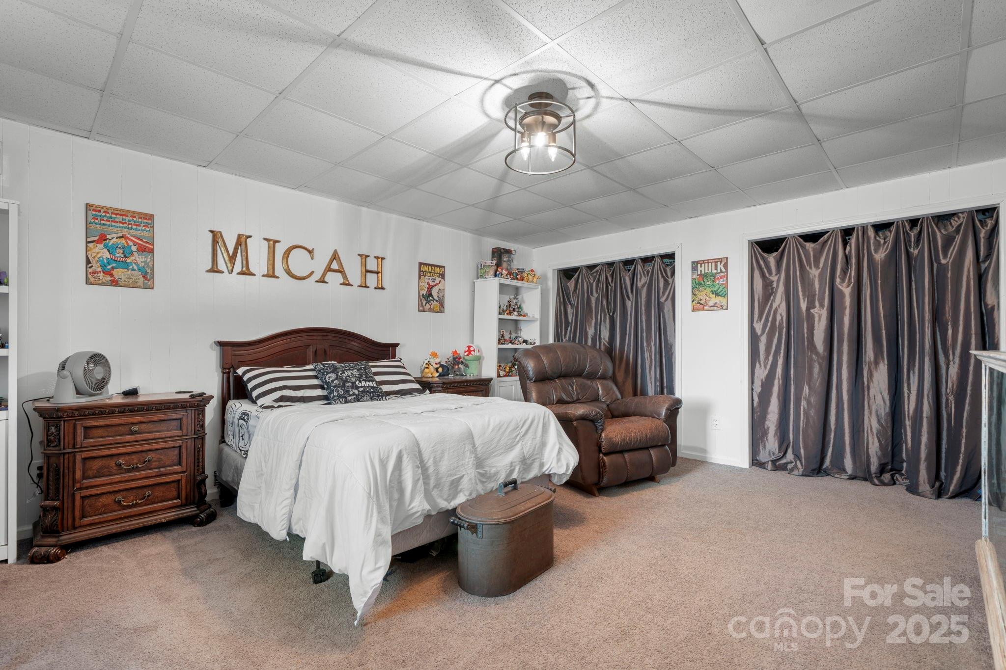 20 Meandering Way Granite Falls, NC 28630 - Photo 35 of 39 a bedroom with bed and a chandelier