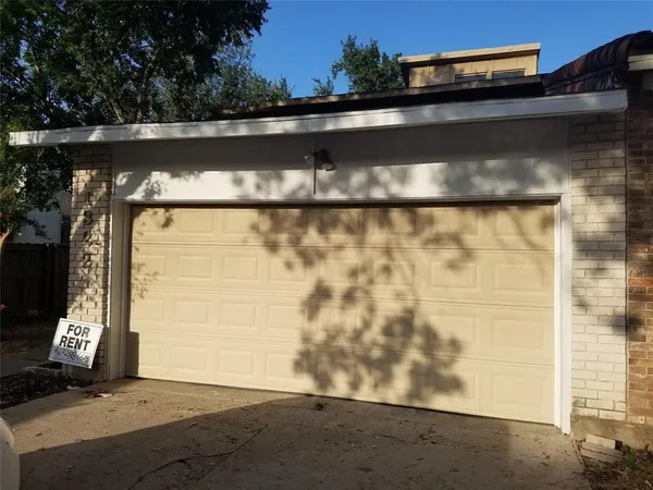 a kitchen with a sink stove top oven and cabinets
