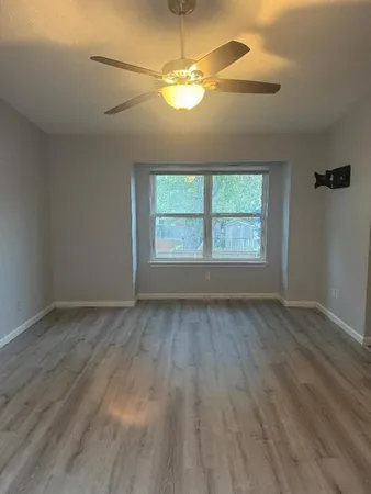 a view of a chandelier fan in a room
