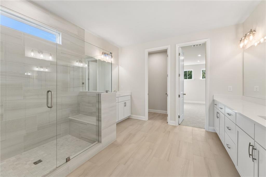 6944 Melody Ridge Road Buford, GA 30518 - Photo 13 of 24 a bathroom with a shower