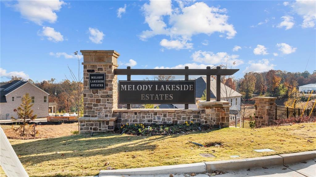 6944 Melody Ridge Road Buford, GA 30518 - Photo 21 of 24 a view of a swimming pool with a patio