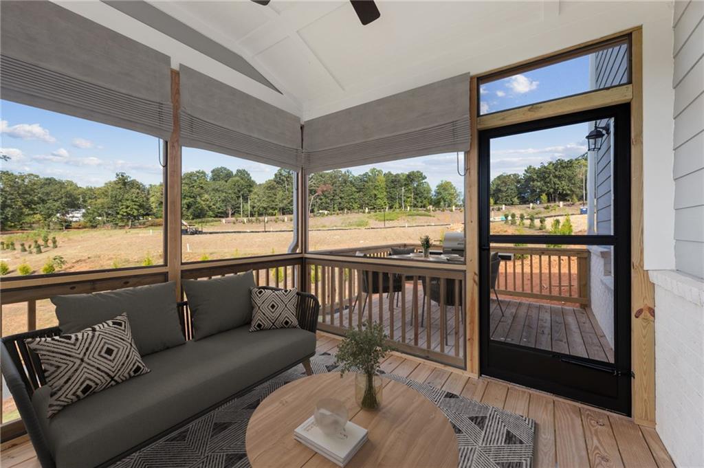 6944 Melody Ridge Road Buford, GA 30518 - Photo 6 of 24 a balcony with furniture and a potted plant