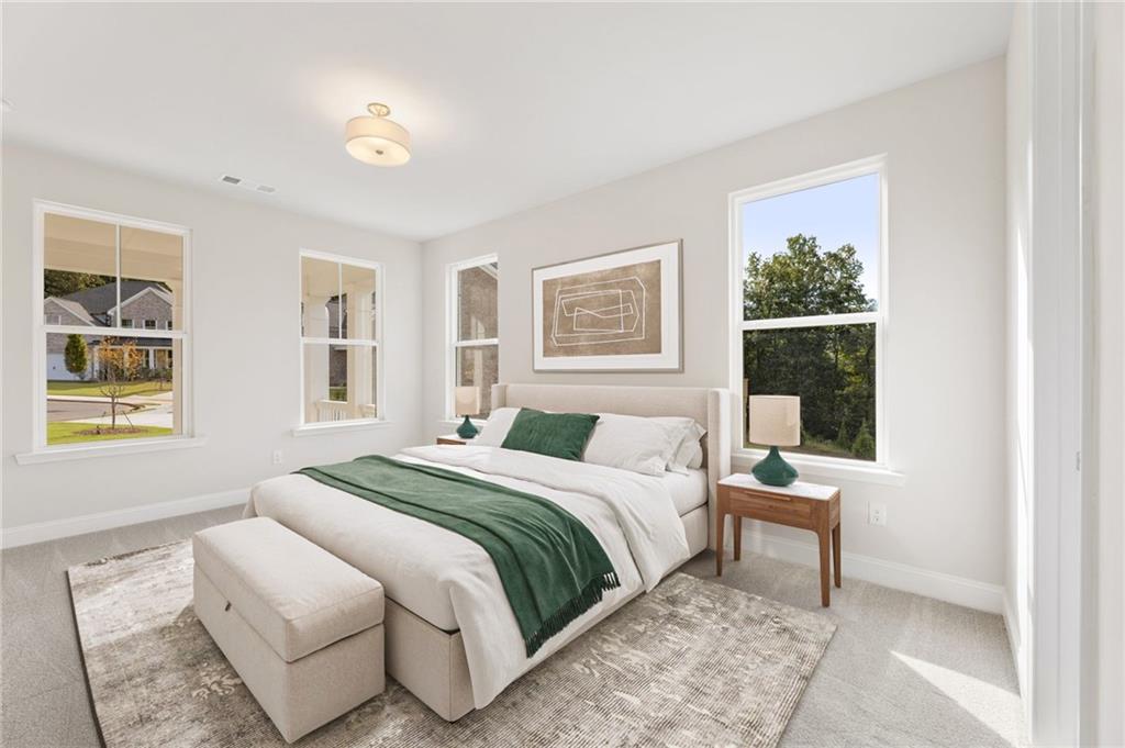 6944 Melody Ridge Road Buford, GA 30518 - Photo 7 of 24 a bedroom with a bed a painting and a window