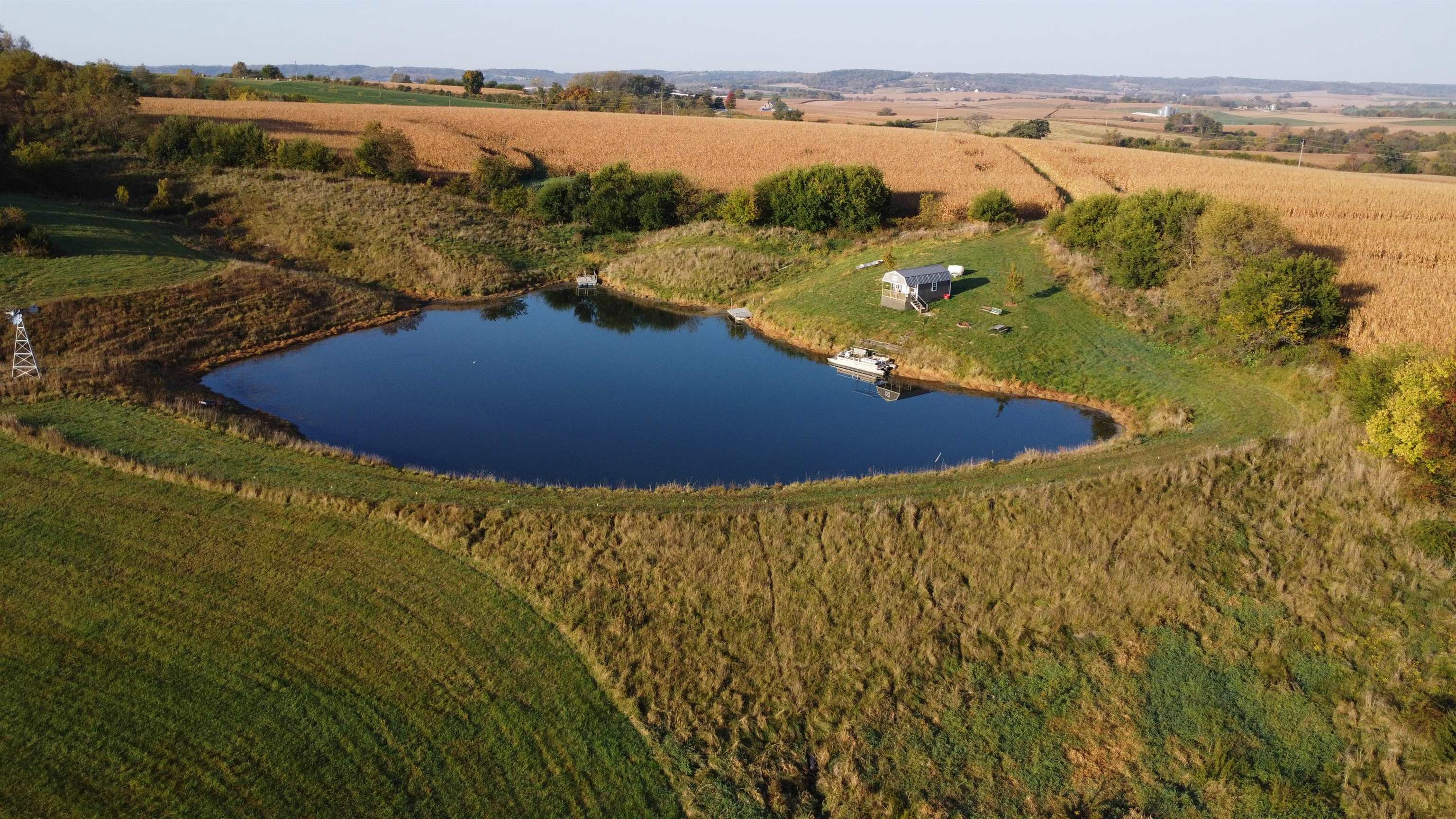 5201 South Burton Road Elizabeth, IL 61028 - Photo 25 of 93 a view of a lake with a yard