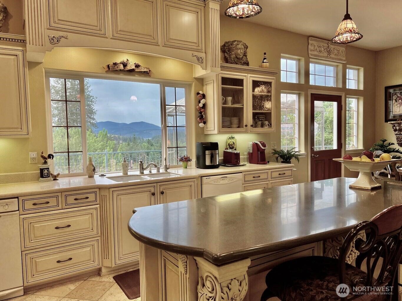 1650 East Fairway Loop Road Colville, WA 99114 - Photo 11 of 30 a kitchen with counter space a sink and cabinets