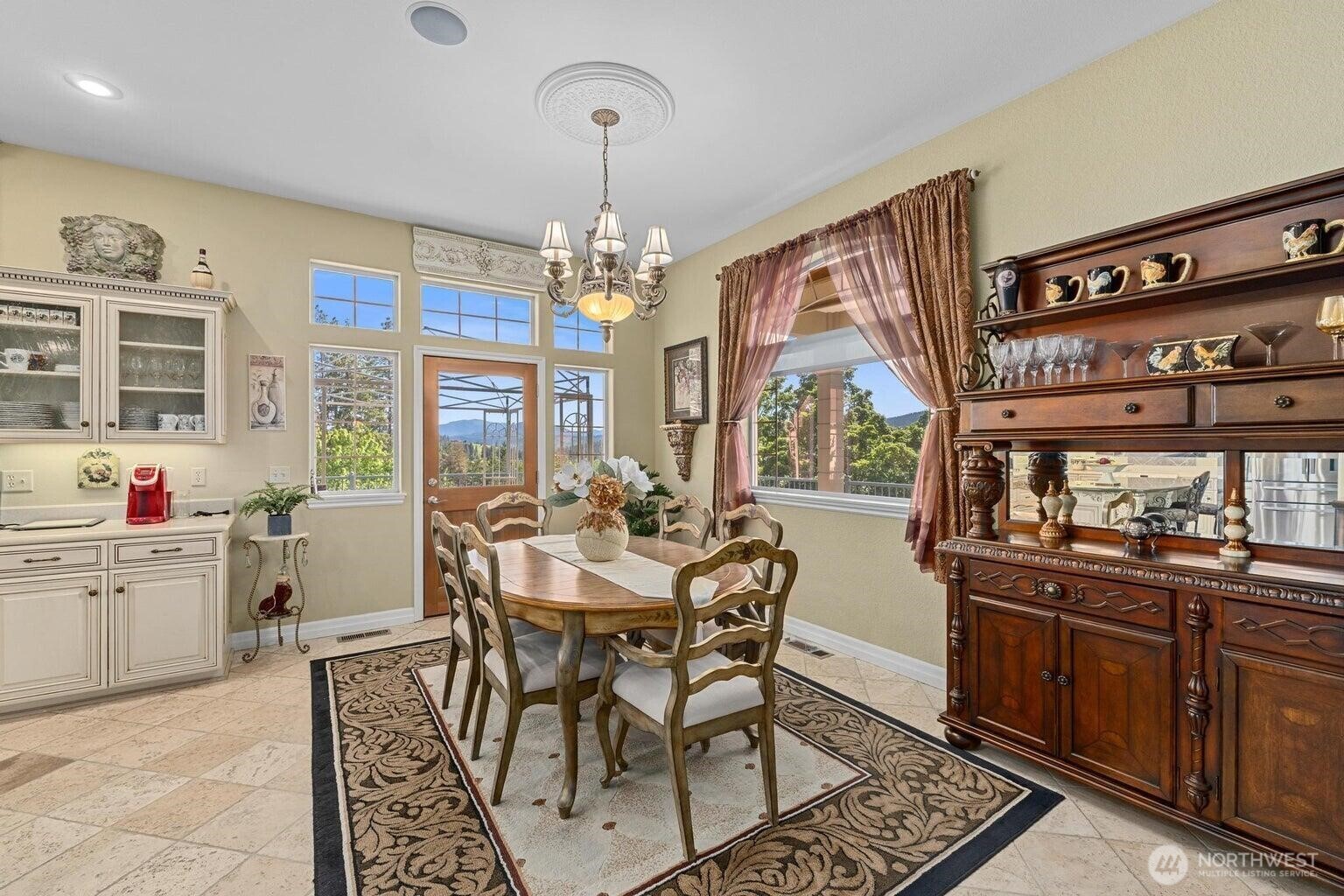 1650 East Fairway Loop Road Colville, WA 99114 - Photo 7 of 30 a view of a dining room with furniture window and wooden floor