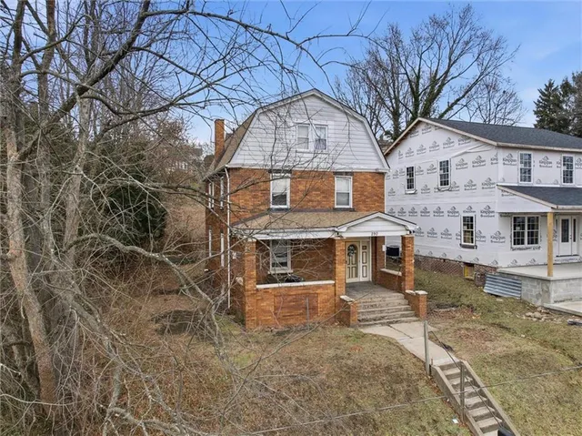 a front view of a house with a yard