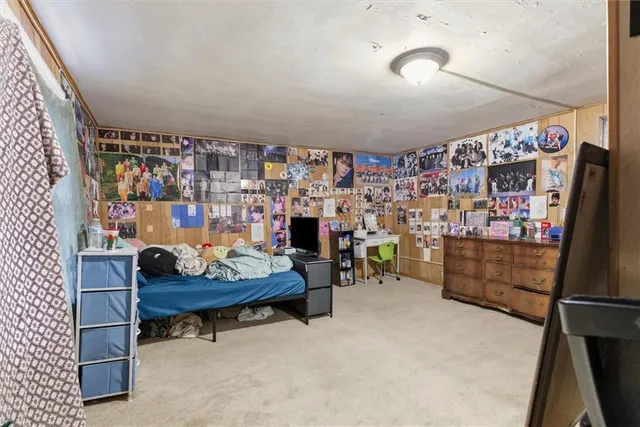 a room with lots of wooden furniture and a table