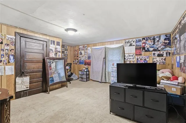a room with furniture and flat screen tv