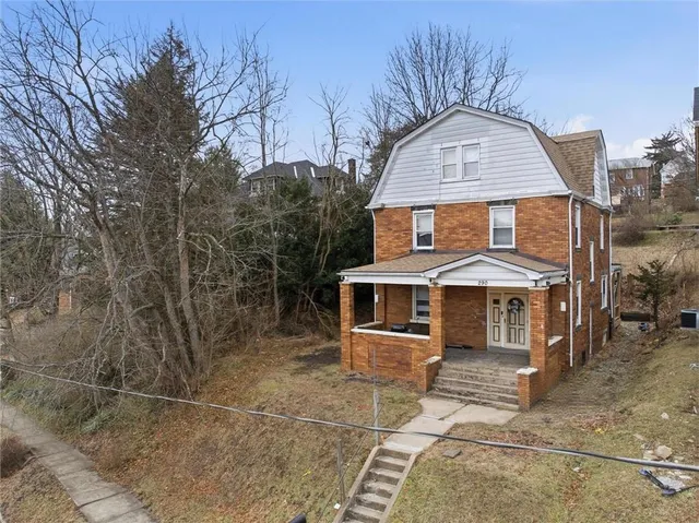 a aerial view of a house with a big yard