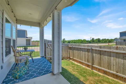 a balcony with furniture and a table