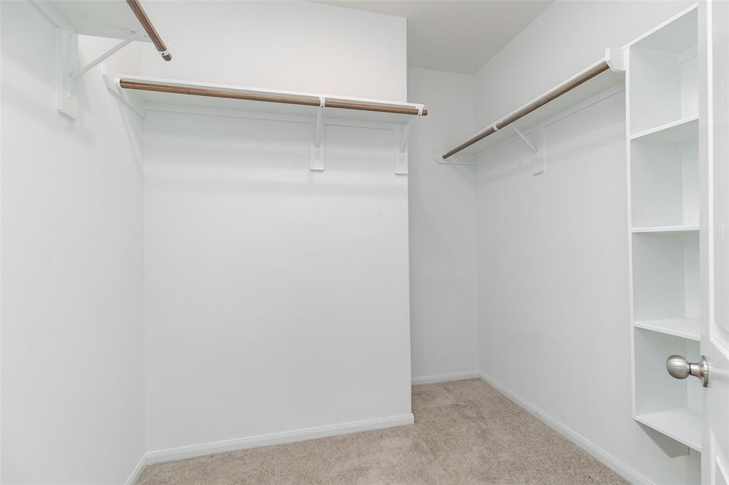 23631 Simmental Road Hockley, TX 77447 - Photo 15 of 22 a view of an empty walk in closet