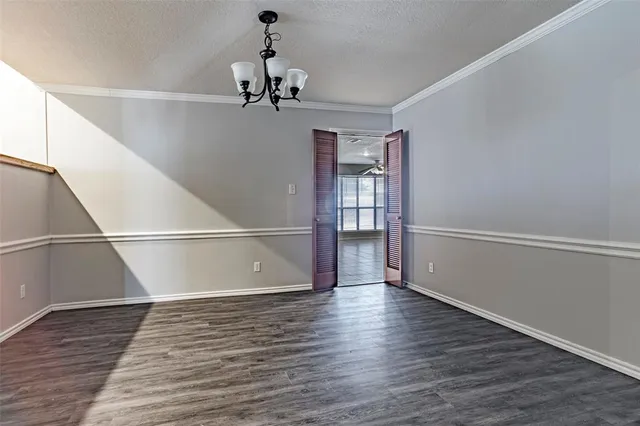 a view of a room with wooden floor and staircase
