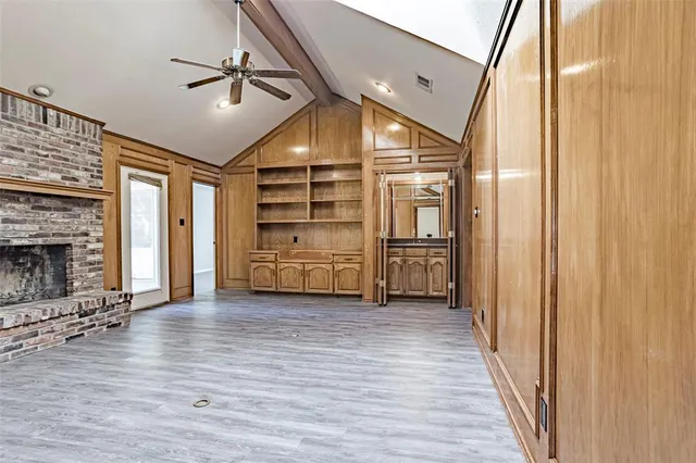 a view of a hallway with a kitchen