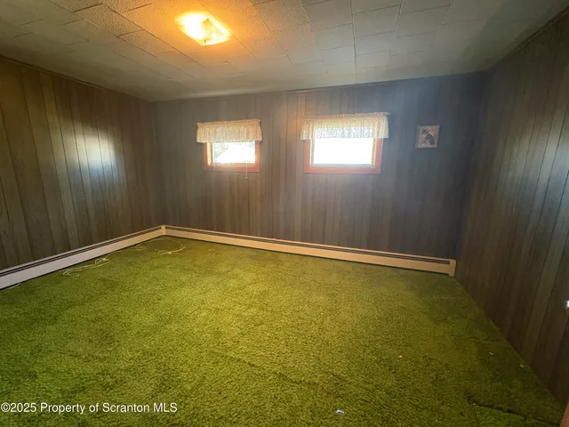 an empty room with closet area