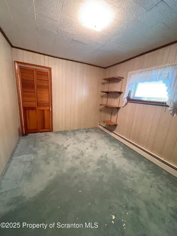 a view of a room with stairs and windows