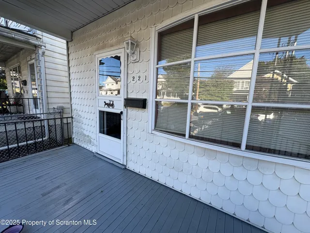 a view of a living room and entryway