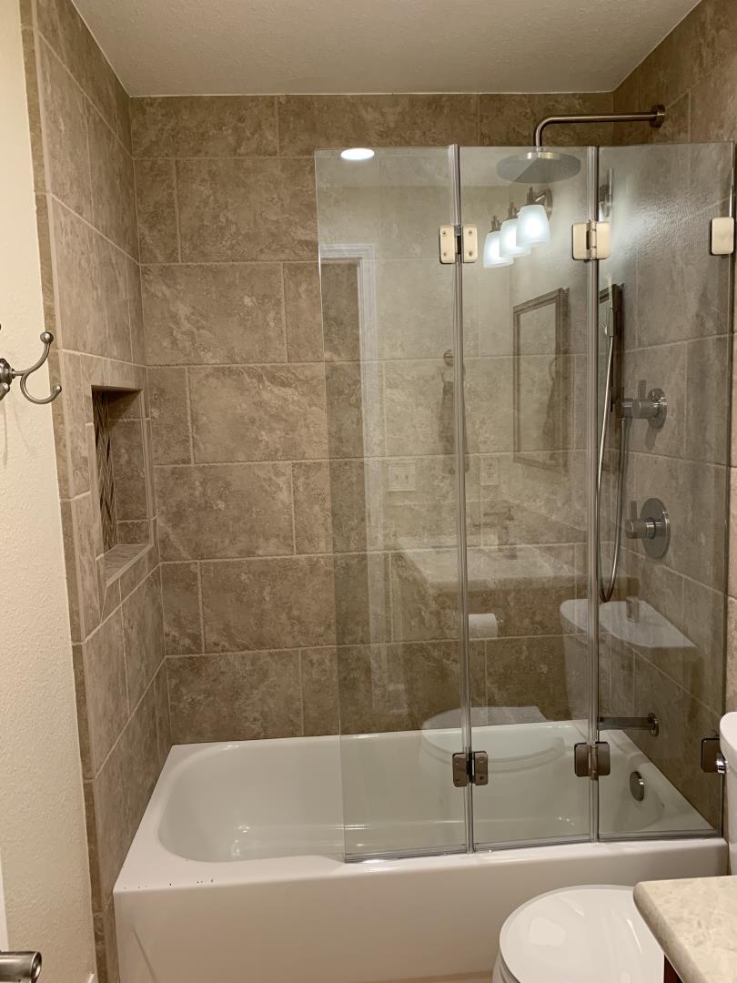 1133 Apache Court Gilroy, CA 95020 - Photo 10 of 15 a bathroom with a bathtub and a shower