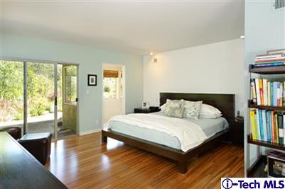 Undisclosed Address Pasadena, CA 91103 - Photo 11 of 15 a bedroom with a bed and a book shelf