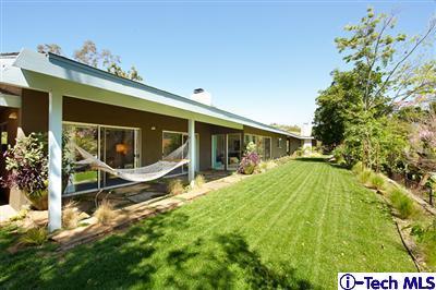 Undisclosed Address Pasadena, CA 91103 - Photo 13 of 15 a view of house with a big yard and potted plants