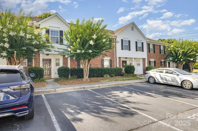 a view of a car parked in front of a house