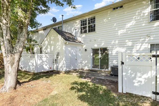 a view of a field with a tree