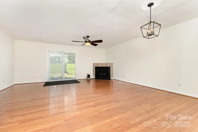 a view of a room with a dishwasher and a window