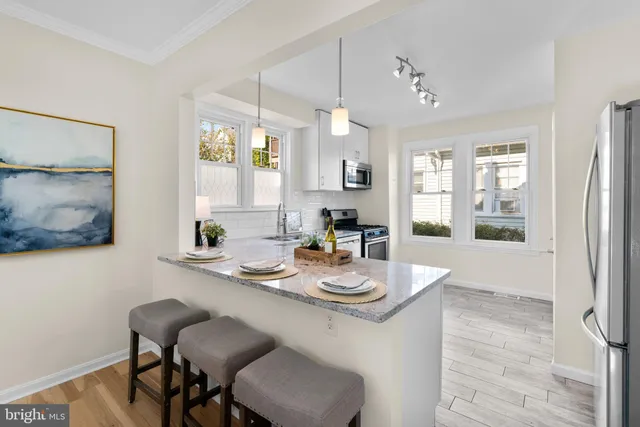 a dining room with furniture and window