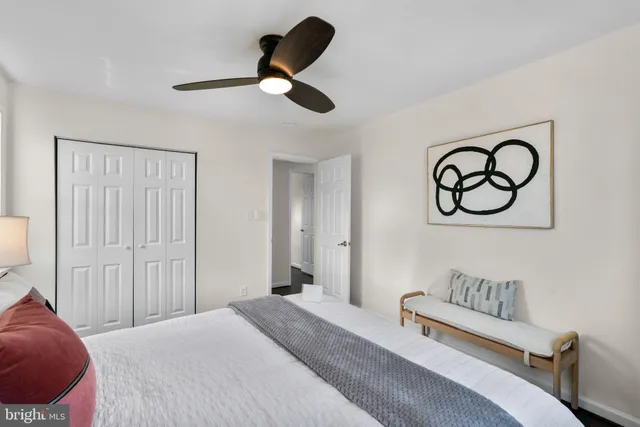 a bedroom with a bed and cabinets