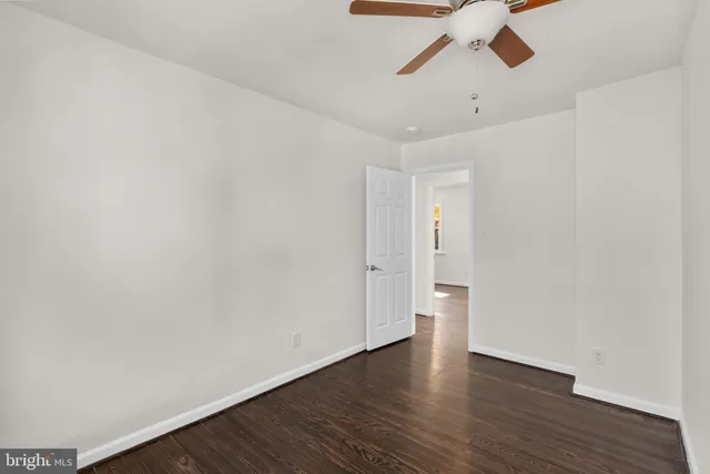 a view of an empty room and wooden floor
