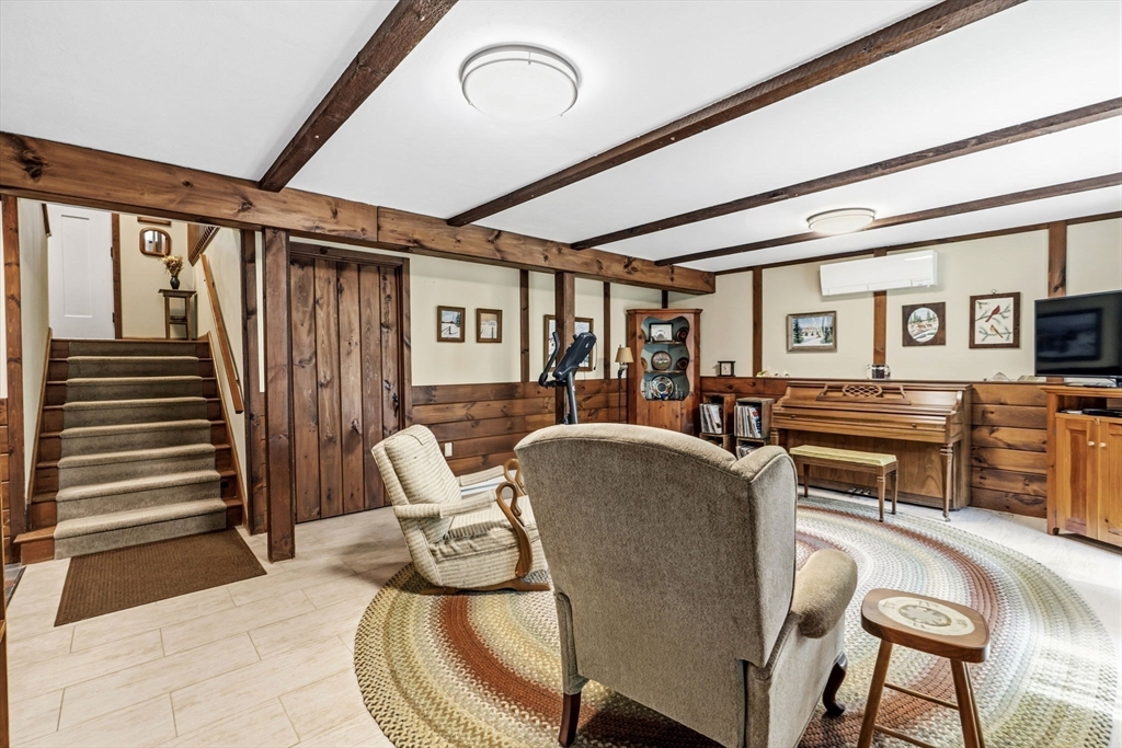 788 Burts Pit Road Northampton, MA 01062 - Photo 32 of 42 a living room with furniture and a wooden floor