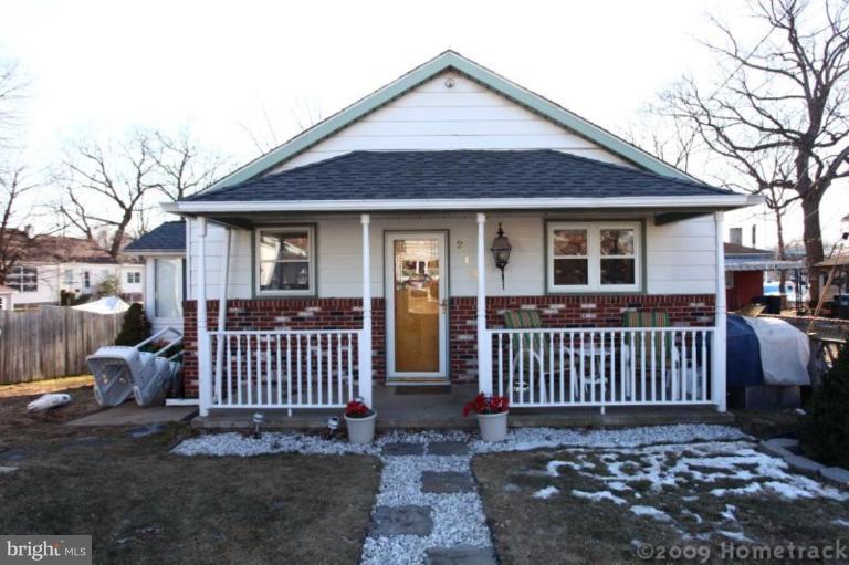 216 Nanticoke Road Essex, MD 21221 - Photo 1 of 19 a view of a house with a small yard and wooden fence
