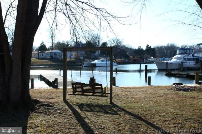 216 Nanticoke Road Essex, MD 21221 - Photo 13 of 19 a view of a lake with a sitting area