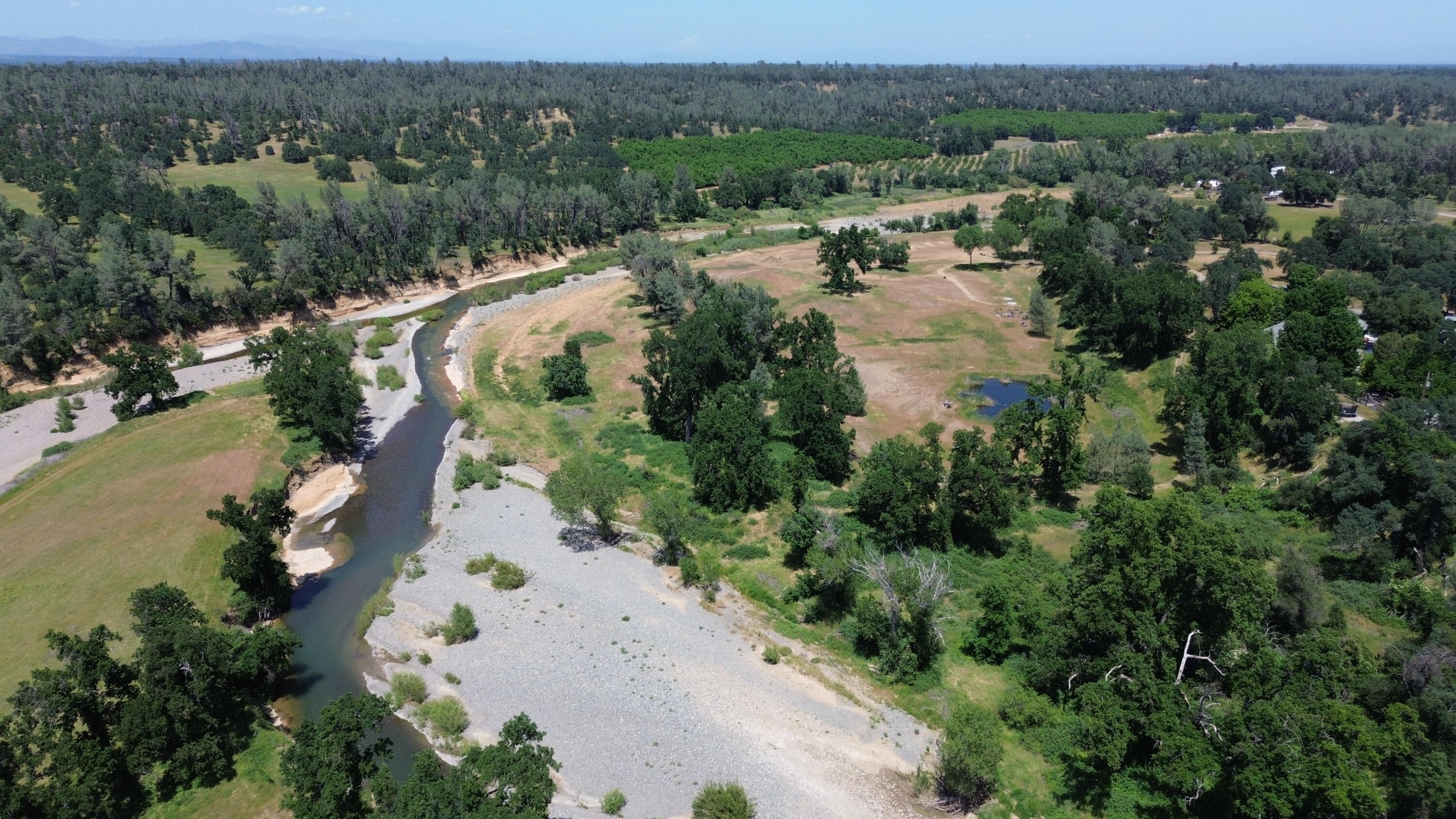Lot 62 Bowman Road Cottonwood, CA 96022 - Photo 7 of 14 an aerial view of residential house with outdoor space and river all around