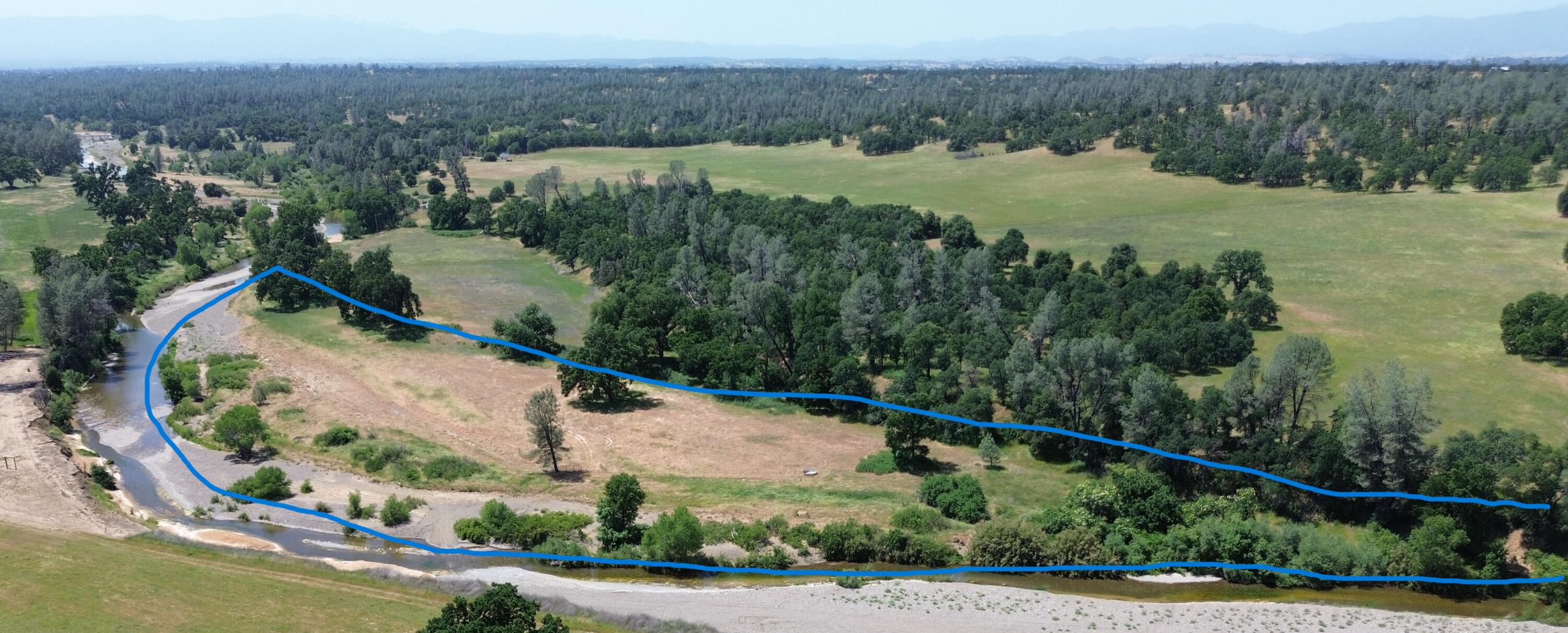 Lot 62 Bowman Road Cottonwood, CA 96022 - Photo 8 of 14 an aerial view of a house with a yard and lake view