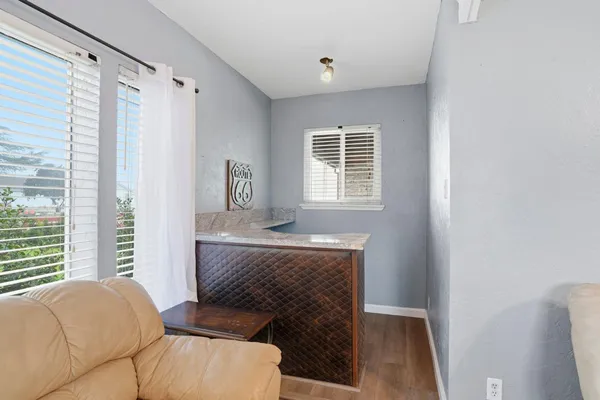 a living room with furniture and a window