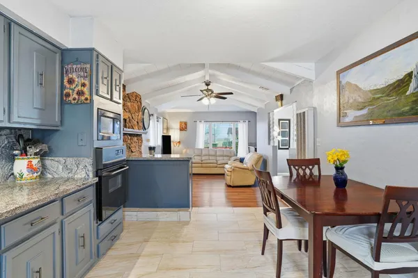 a kitchen with granite countertop lots of counter top space and dining table