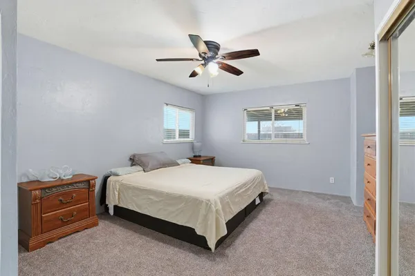 a bedroom with a bed and window