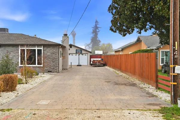a view of a house with a backyard