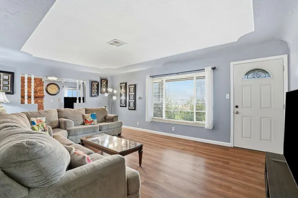 a living room with furniture and a window