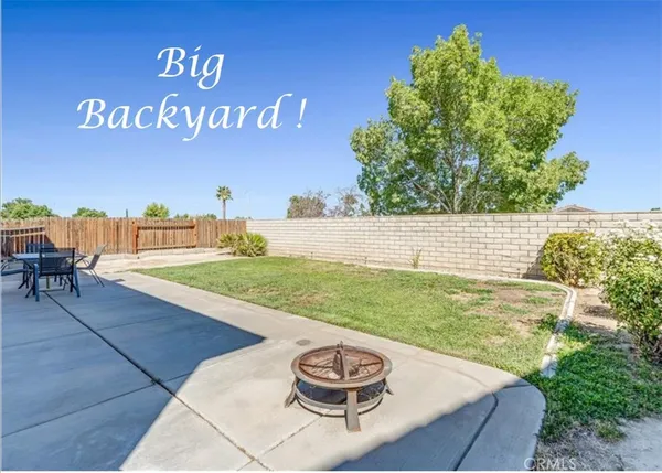 a view of a back yard of the house