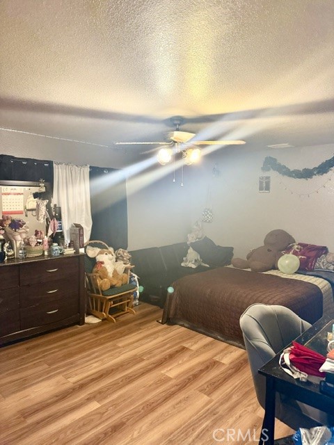 13375 Rincon Road Apple Valley, CA 92308 - Photo 22 of 72 a bedroom with a bed and a dresser