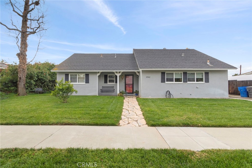 2942 Sandberg Street Riverside, CA 92506 - Photo 1 of 1 a front view of a house with a garden