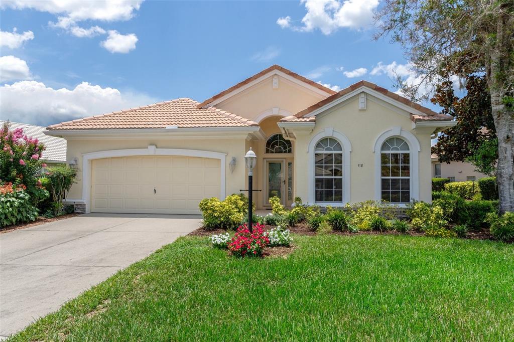 118 West Doerr Path Hernando, FL 34442 - Photo 1 of 1 a front view of a house with a garden