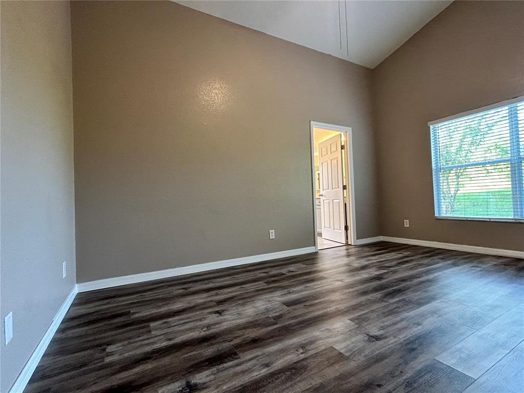 1230 Legatto Loop Dundee, FL 33838 - Photo 15 of 38 Primary Bedroom