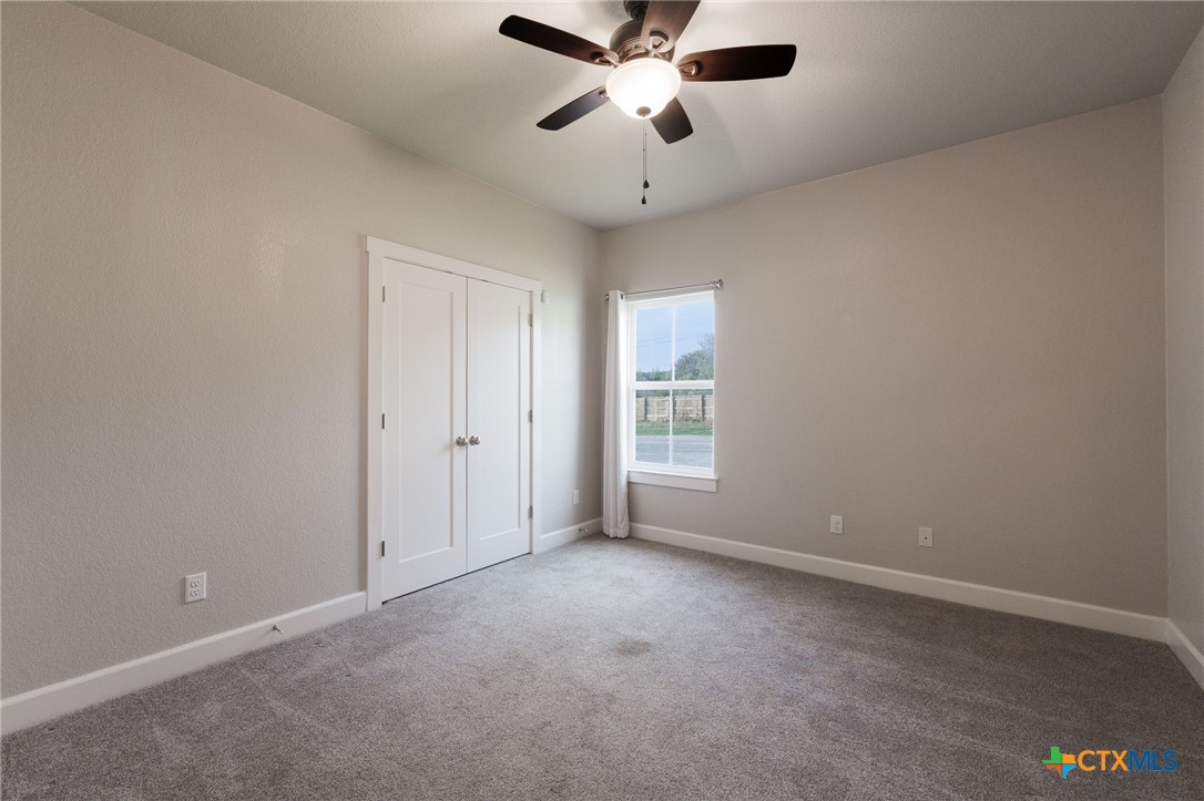 2662 Snow Road Kempner, TX 76539 - Photo 13 of 28 an empty room with a window and a fan